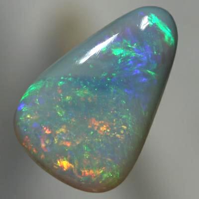 SOLID SEMI BLACK OPAL Sparkling orange moves to green rolling flashes